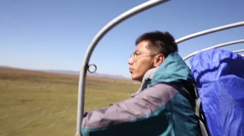 A man looks into the distance while riding Stock Footage 55708111