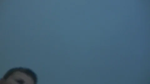 Man looks down at dead person and checks pulse. Stock Footage 99609506