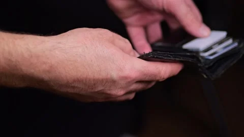 A man looks into an empty wallet. Inflation took all the money, unemploymen.. Stock Footage 234870954