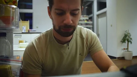 Man looks in the frige Stock Footage 71042410