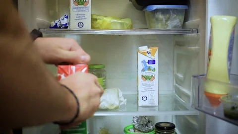 Man looks in the frige Stock Footage 71042416