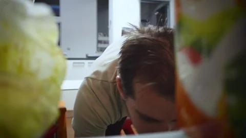 Man looks in the frige Stock Footage 71042452