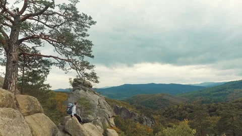 Man Looks at Highest Rocks Stock Footage 96311155