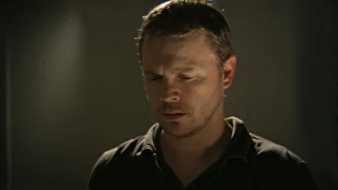 Man looks at him self in the mirror. Stock Footage 99608285