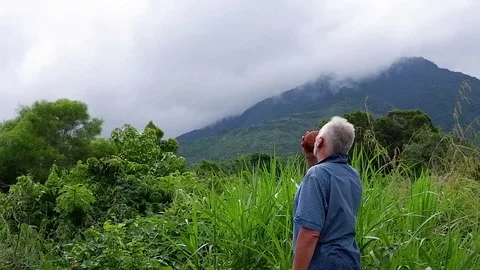 A man looks at the mountain. Video stock 122272084