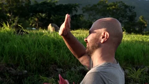 A man looks at the mountains during sunset Vídeo Stock 145630005