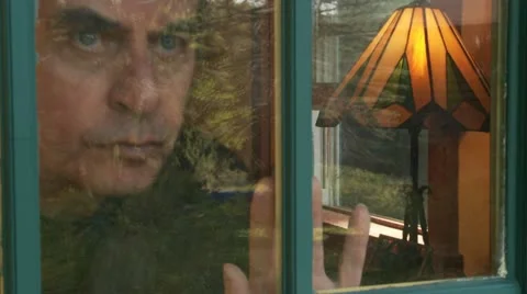A Man Looks Out Window 库存影片 12019844