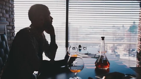 Man looks out the window Video stock 76951097