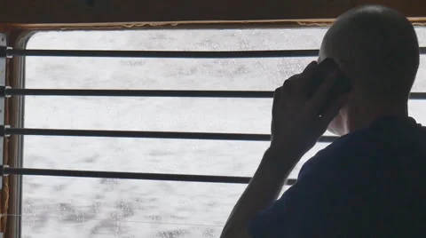A man looks out the window in the train Stock Footage 61772456