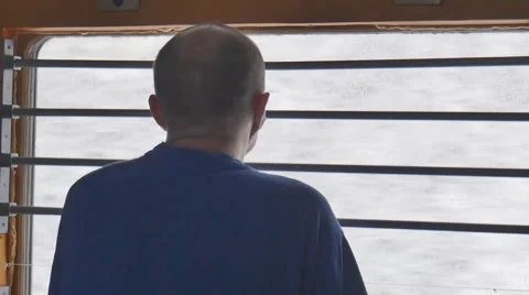 A man looks out the window in the train Stock Footage 61772491