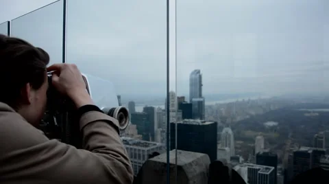 Man looks over the New York city scape as the camera pans right Stock Footage
