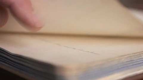 A man looks over some old historical books in a library in Belfast. Stock Footage 147872085