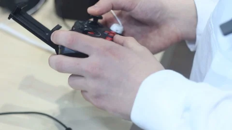 Man looks at the quadrocopter control system Stock Footage 87135380