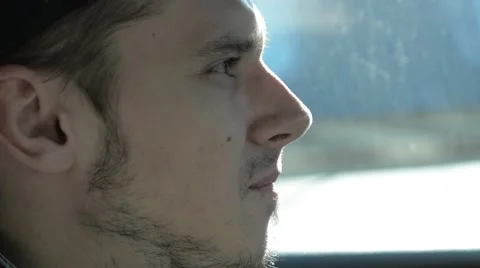 A man looks into the rearview mirror. Stock Footage 51756570
