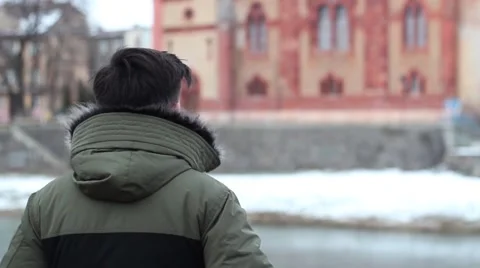Man looks at the river Stock Footage 59168931