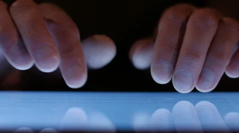 A man looks at a tablet computer graphics, applications, social networks. Video stock 62886520