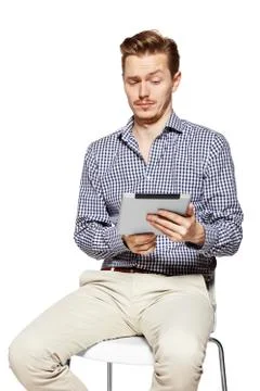 Man looks on tablet Stock Photos