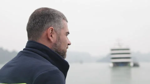 Man looks thoughtfully at seascape. Stock Footage 305833784