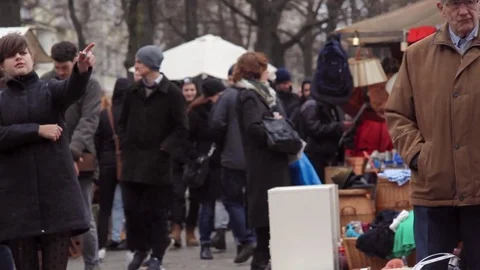 Man looks through book at flea market, Berlin, Germany Stock Footage