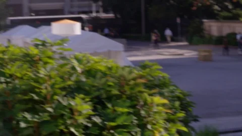 Man looks through a camera viewfinder to frame his picture outdoors - shot on Stock Footage 123438756