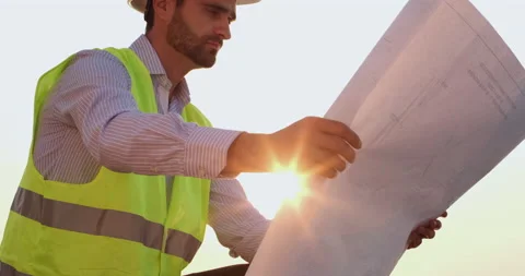 Man looks through cranes paper drawing against bright sun Stock Footage 166270575