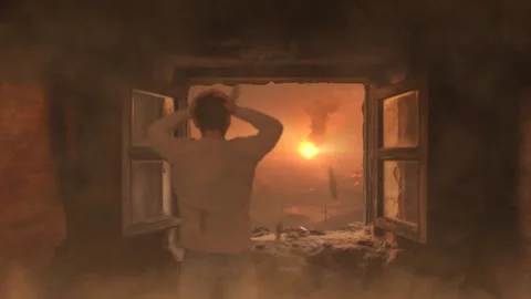 Man looks through old window on destroyed building that collapsed from an Stock Footage 252927586