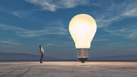 The man looks up towards a big bulb Illustrazione stock