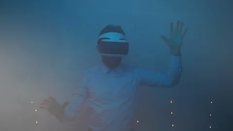 Man is lost in augmented reality, young engineer testing virtual reality headset Stock Footage 124770914