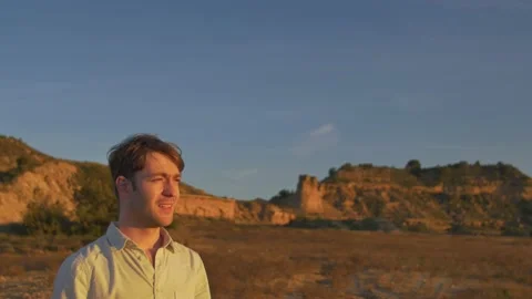 A man lost in the desert seeks his way at sunset, in Spain Stock Footage 208835794