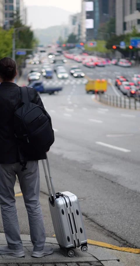 Man lost the hope that cab will arrive, go away with suitcase, blurred back Video stock 303989900