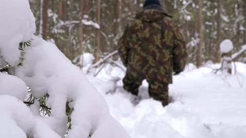 A man lost in a winter forest walks through deep, loose snow. 스톡 동영상 106250816