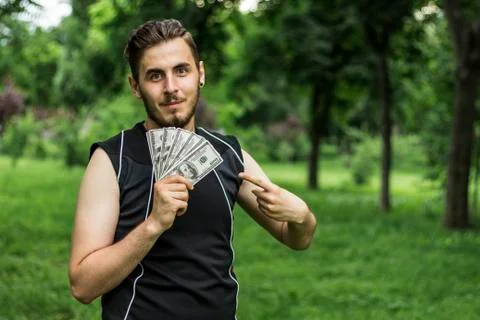 Man with a lot of dollars Stock Photos