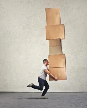 Man with lots of boxes Stock Photos