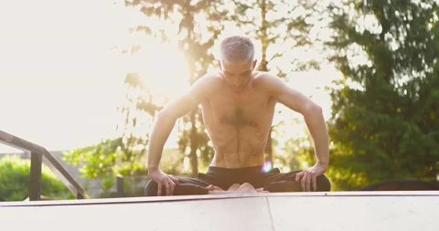 Man in lotus position practicing belly motion technique.Guy doing abdominal Stock Footage 158331754