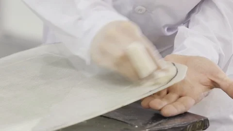 Man Lubricates the Composite Stock Footage 87613227