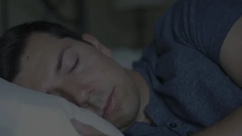 Man Lying Awake at Night Stock Footage 114703736