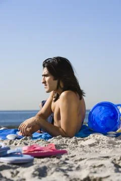 Man lying on the beach Foto stock