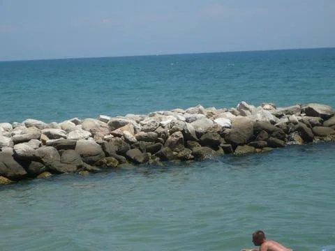 The man is lying on the beach Stock Photos