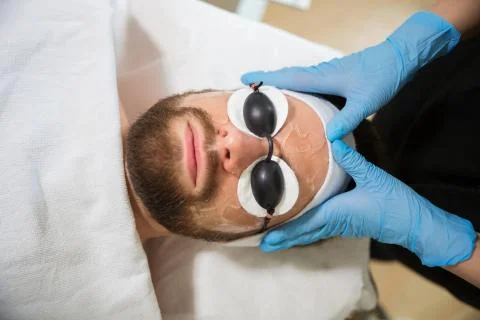 Man lying at beautician's Stock Photos