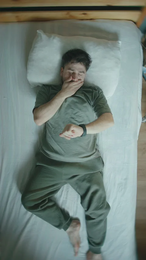 Man Lying in Bed Checking Smartwatch at Night, Insomnia and Sleep Disorder .. Stock Footage 344462417