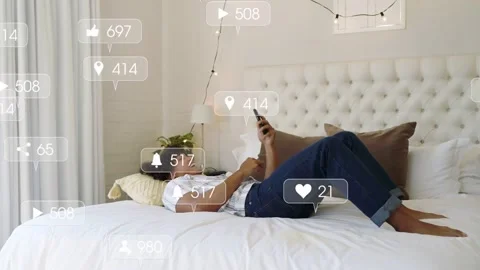 Man lying on bed scrolling smartphone, receiving multiplying notifications and Stock Footage 333301193