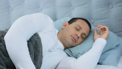 Man Lying in Bed Sleeping Deeply,  Resting and Relaxed Stock Footage 113223047