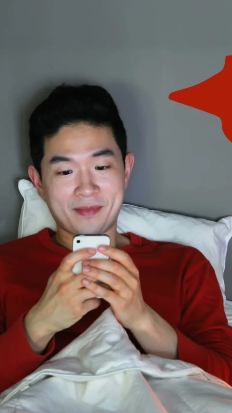 Man lying in bed while checking his social media account 4k Stock Footage 341917972