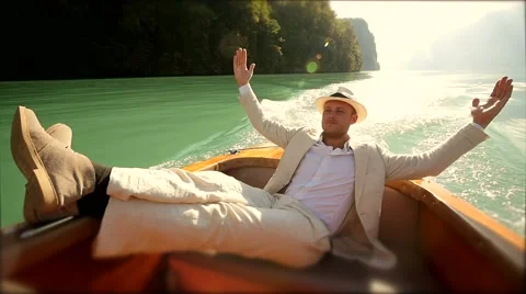Man lying on boat deck enjoying life. carefree person. casual cloth Stock Footage 42951275
