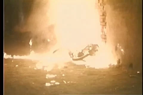 Man lying by burning motorcycle Stock-Footage 11354383