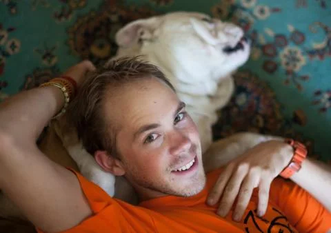A man lying on the carpet Stock Photos