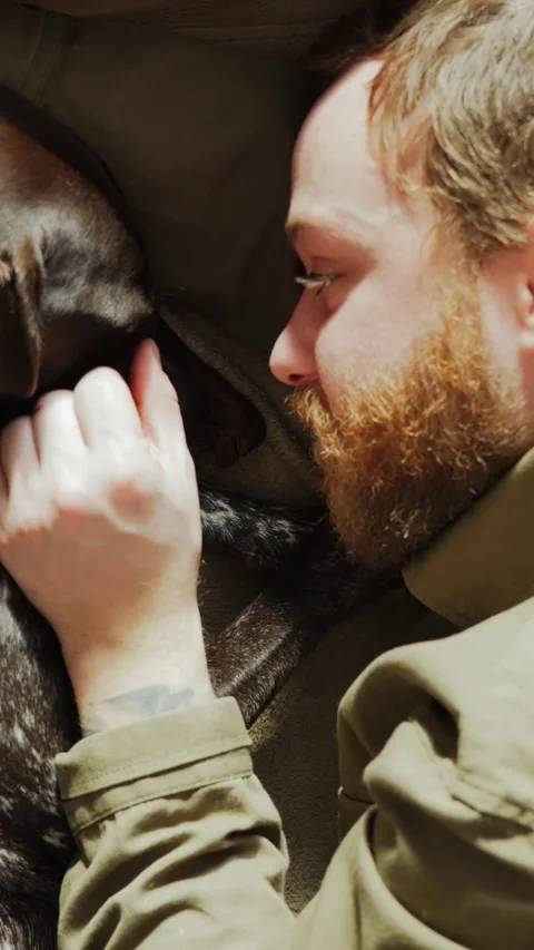 Man Lying Face to Face With Dog Stock-Footage 320803570