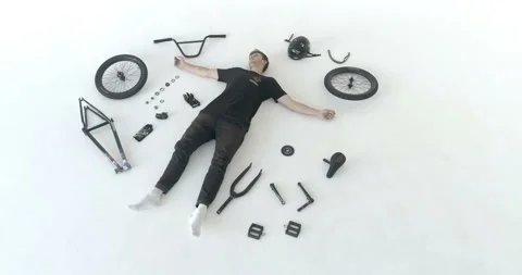 Man is lying on the floor among the bicycle spare parts Stock-Footage 103246870