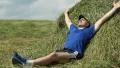 Man lying on a haystack, stretching oneself, breathing deep HD Footage