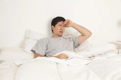 Man lying with headache 写真素材